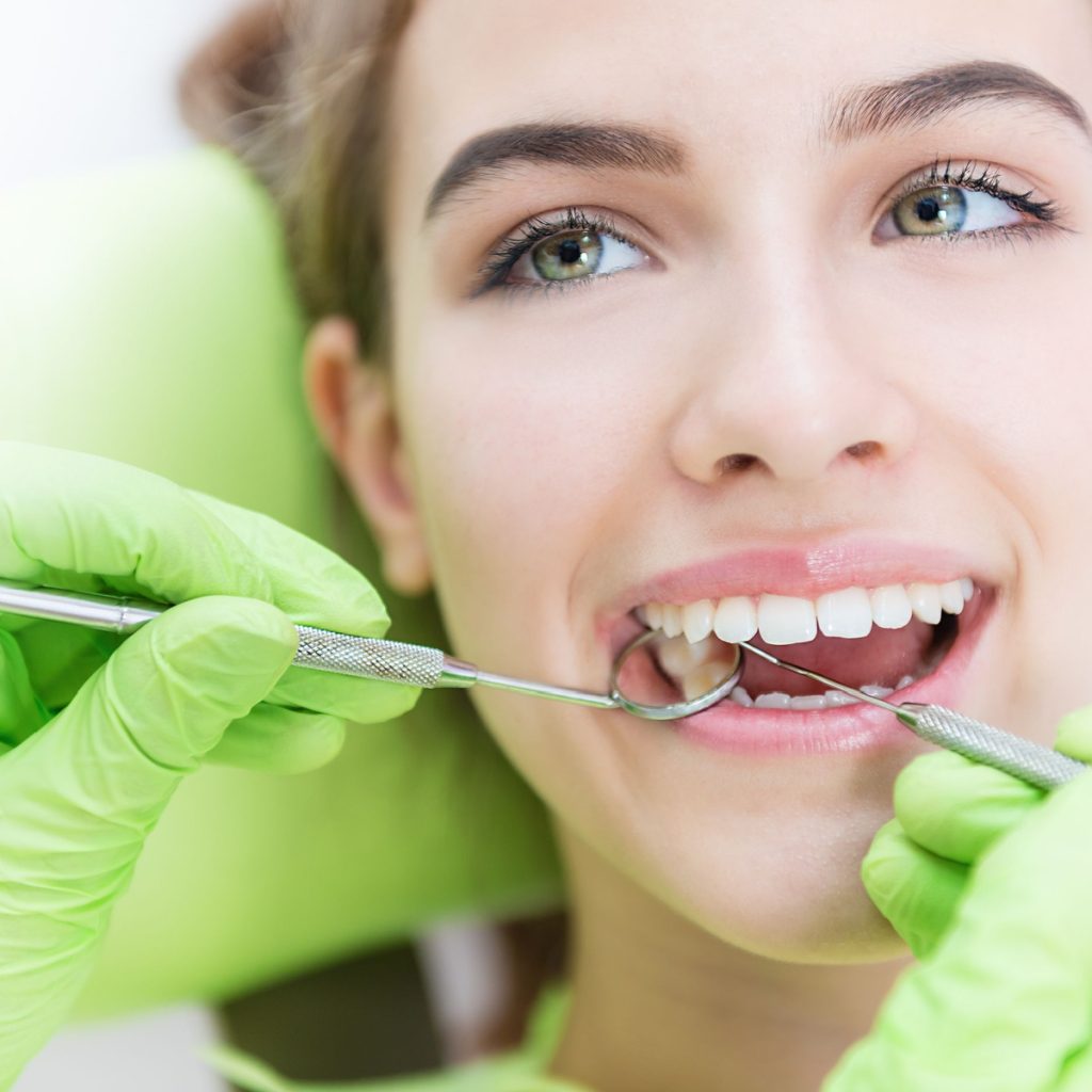 dental exam with smiling woman